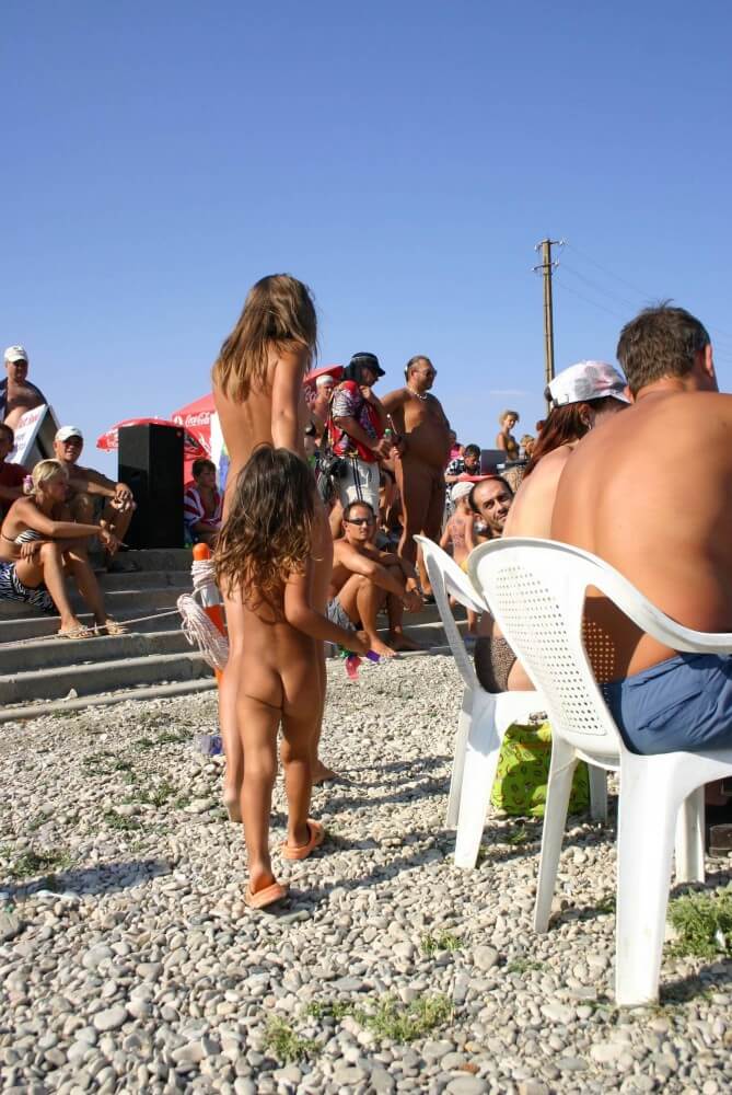 Naturist Standing Sideline - Nudism and naturism are based on naturalness and acceptance of ones body