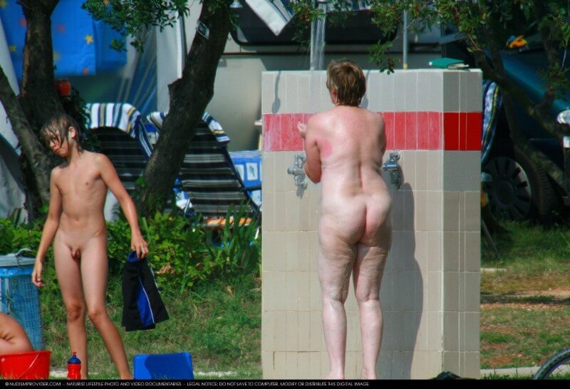 Covered in Towel Nudists-Boardwalk Biking - People who participate in nude recreation seek psychological comfort