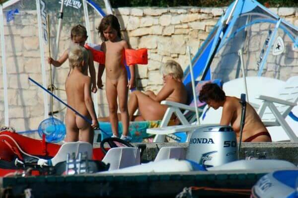 By the boat photos - Overcoming inhibitions is one of the goals of nudism