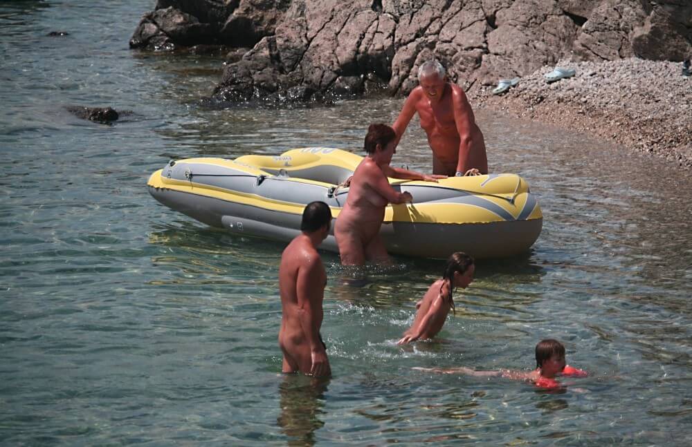 Lone Nudist in Yellow Boat photos - Naturism teaches us to accept differences and imperfections without shame or insecurities