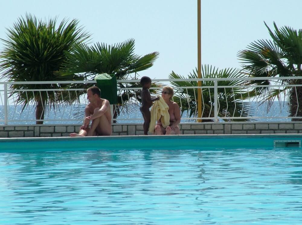 Photo of naturists in an outdoor pool - We have nothing against nudism per se